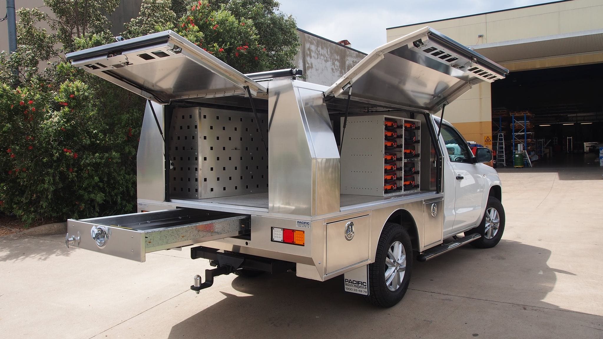 Aluminium ute canopy with gullwing doors open and a rear slide-out drawer